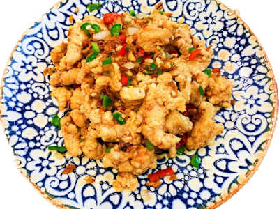 Pollo Rebozado con Cebolla y Pimienta